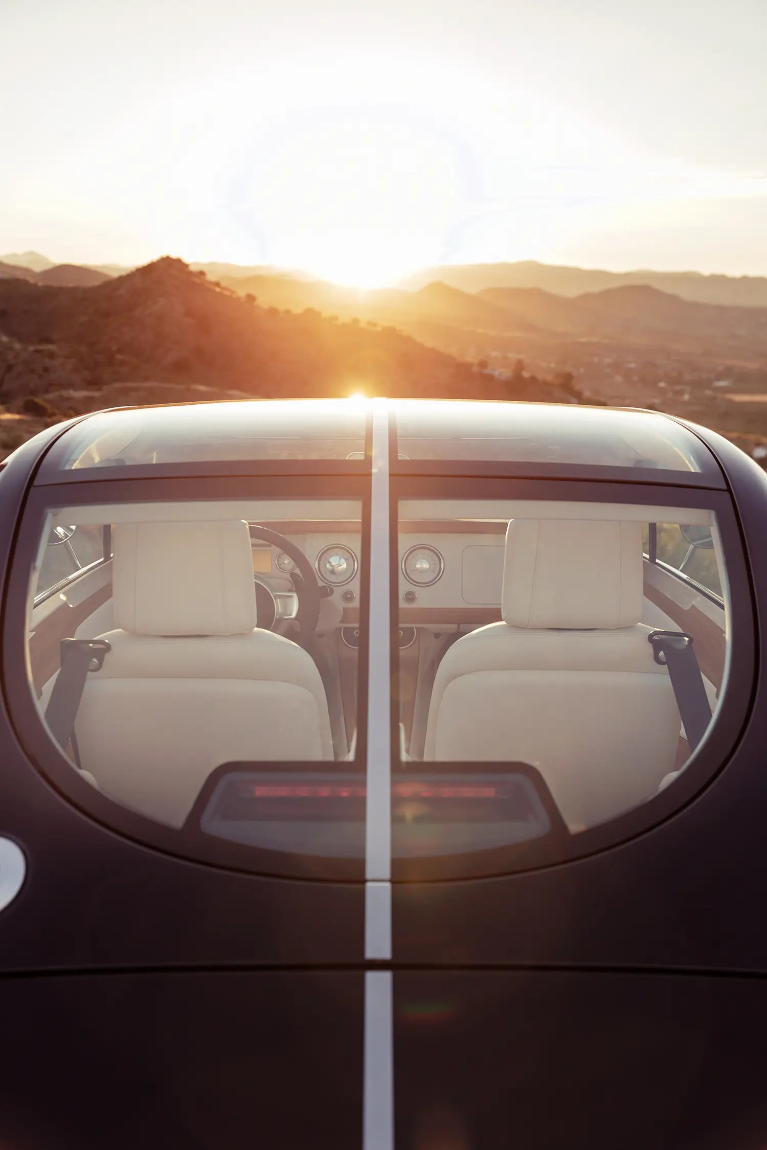 Morgan Midsummer Coupé rear glazing sun light interior white leather seats