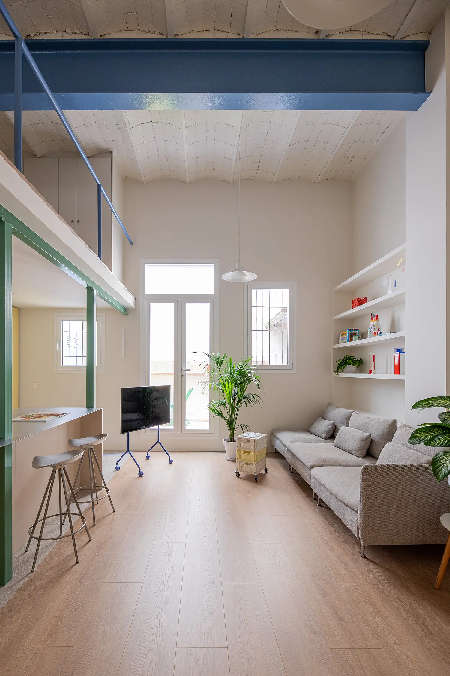 Not a Studio Monterols Barcelona single open volume living area Catalan vault blue iron beam laminate flooring
