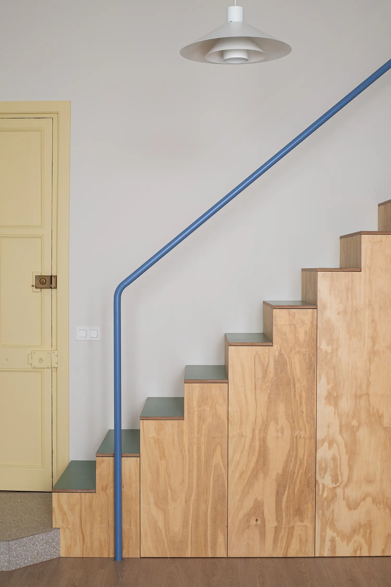 Not a Studio Monterols Barcelona phenolic pine plywood staircase blue handrail green tread surface storage integrated