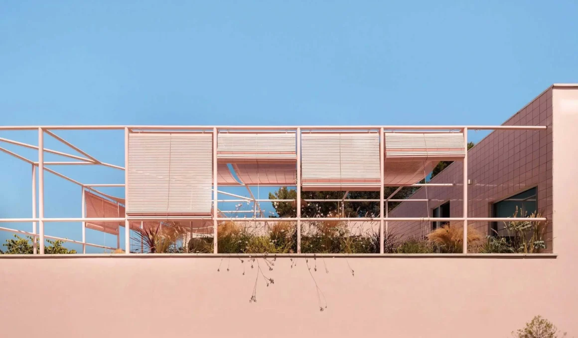 Casa Galamares atelier RUA Sintra pink ceramic tile facade tubular steel pergola roll-up reed blinds textile shade sails