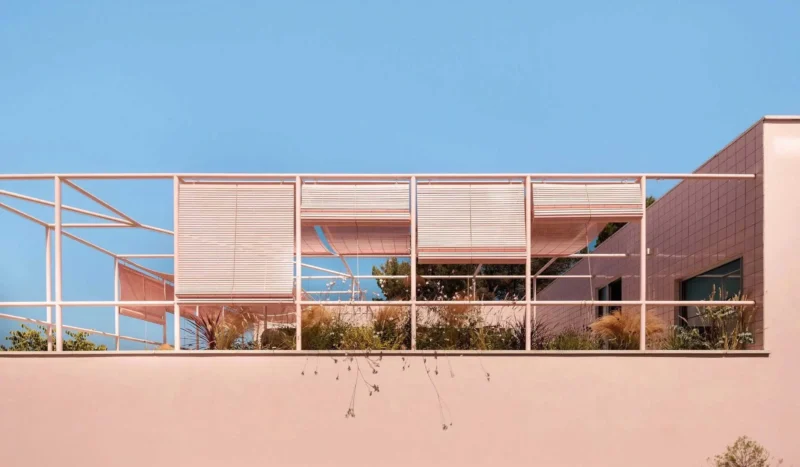 Casa Galamares atelier RUA Sintra pink ceramic tile facade tubular steel pergola roll-up reed blinds textile shade sails