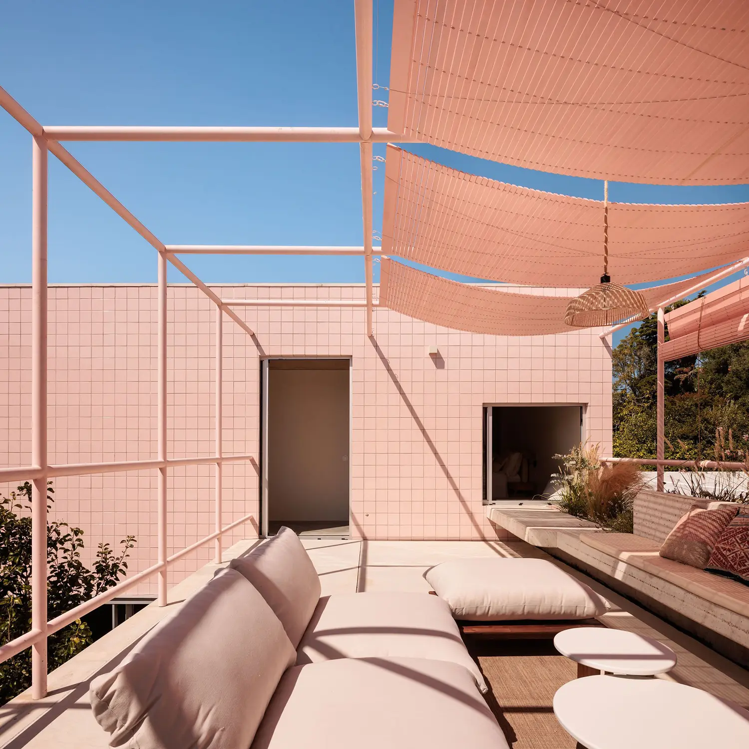 Casa Galamares atelier RUA rooftop terrace textile shade sails pink steel pergola outdoor linen sofa concrete floor Sintra Portugal