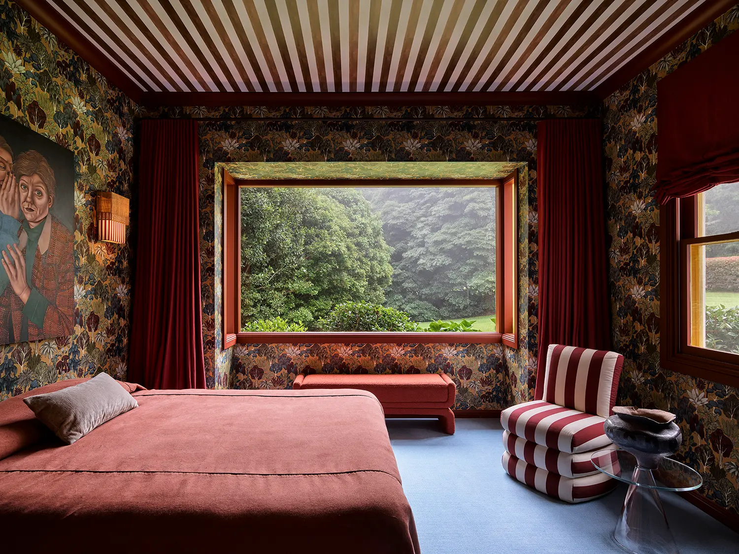 Plantasia YSG Studio New South Wales master bedroom autumnal foliage wallpaper striped ceiling sky blue carpet merlot bedding window tree view