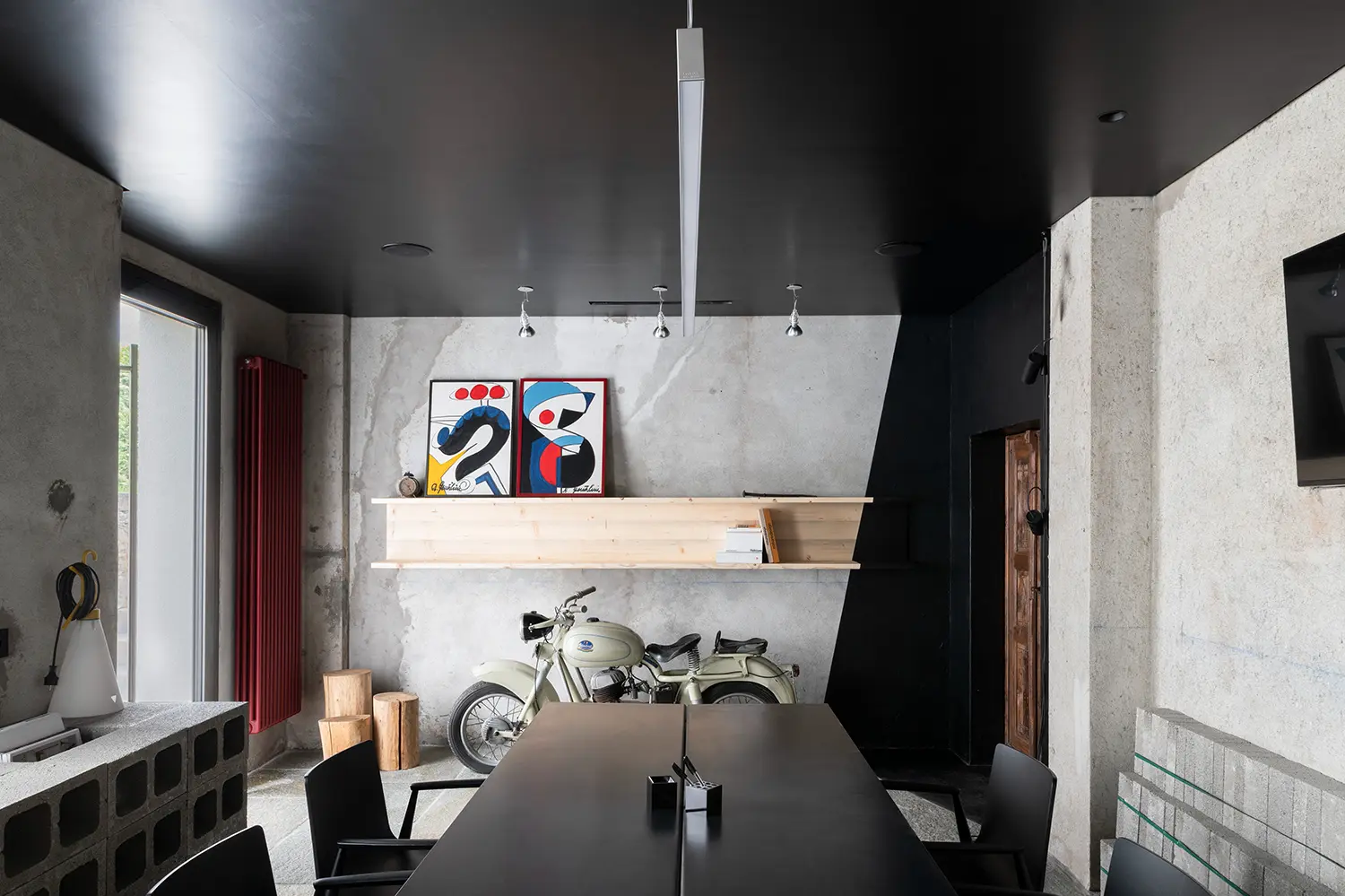 RAW Studio Moroni Architettura Sondrio iron table perforated concrete blocks red radiator vintage motorcycle art prints