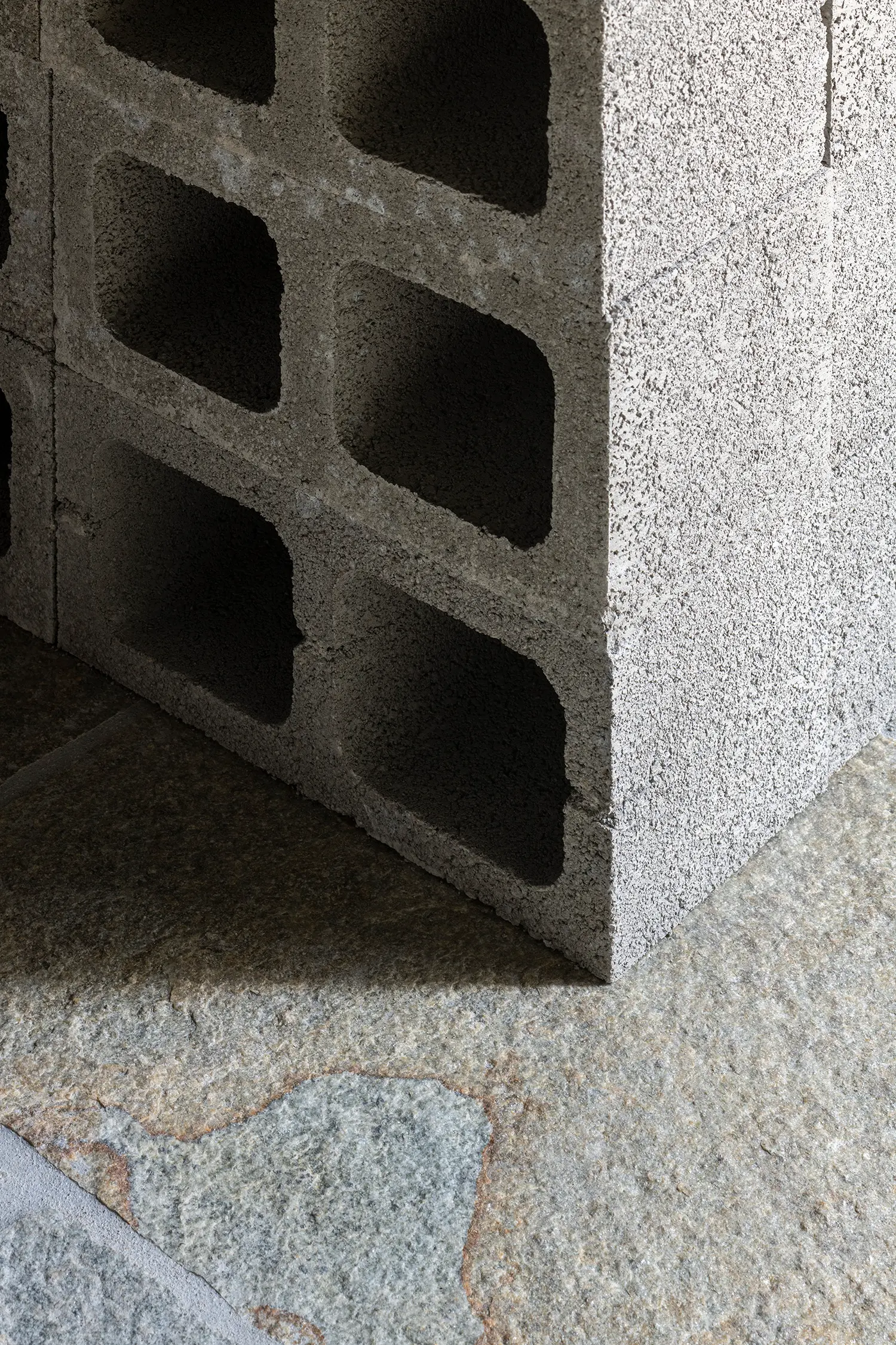 RAW Studio Moroni Architettura Sondrio perforated concrete blocks dry assembled seating stone floor detail close-up