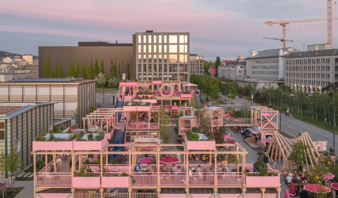 Remise Rosa Hello Wood Zurich West aerial view pink CLT timber three-level complex former railway site sunset