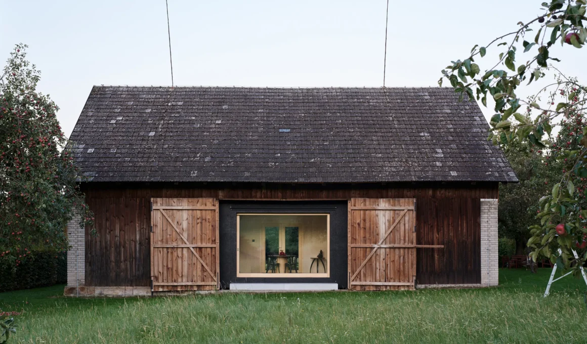 The Box in the Barn Facha architekti Brtev Czech Republic exterior barn garden apple trees panoramic window birch plywood interior visible