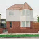 Front elevation of Wade House by Wadhal in Ruislip, two-storey new-build with red brick base, white render upper level, fired-clay tiled roof, and timber-clad gable end