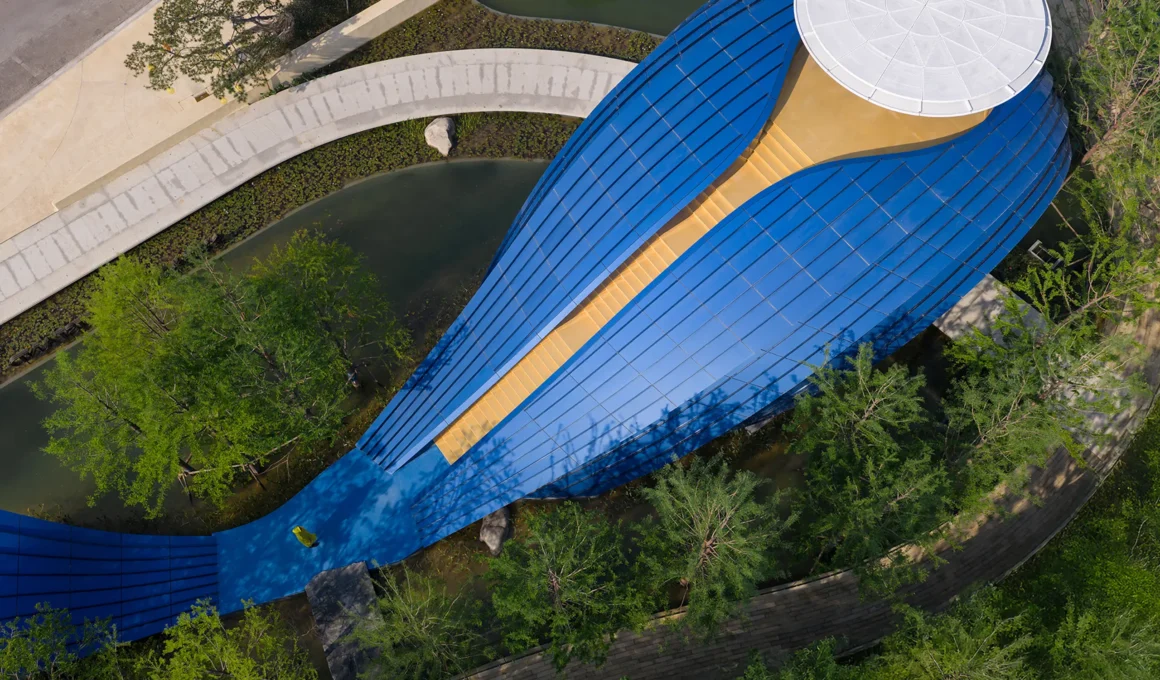 Whale Gate Wutopia Lab Shangqiu Henan aerial view blue aluminum biomorphic gateway golden staircase 242sqm