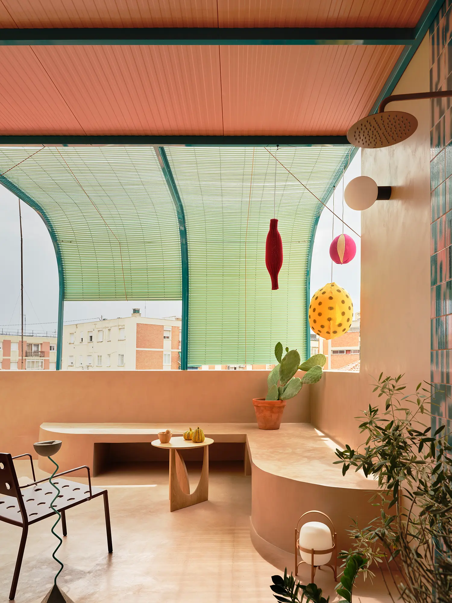 Macedonia by Bardo, terrace with curved terracotta benches, cactus, and tubular green shading structure