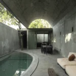 Casa Gruta vaulted concrete dining and lounge area beside plunge pool, Salvador Román & Adela Mortera, Valladolid, Yucatán