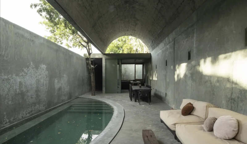 Casa Gruta vaulted concrete dining and lounge area beside plunge pool, Salvador Román & Adela Mortera, Valladolid, Yucatán