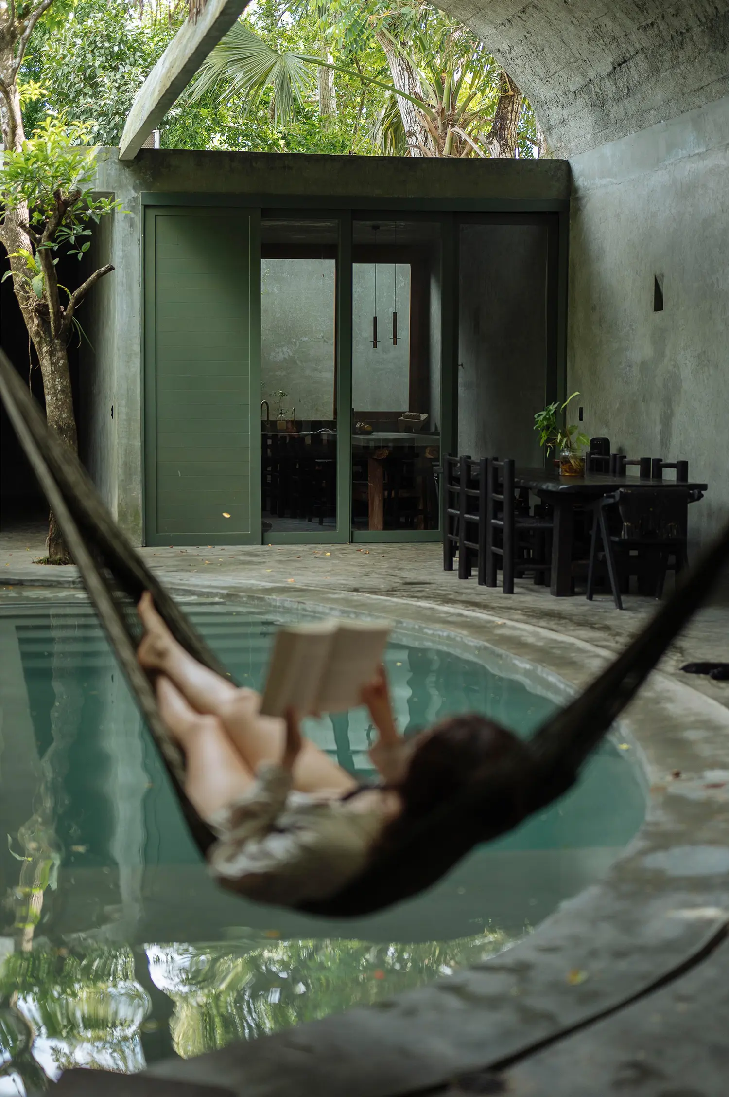 Casa Gruta plunge pool and hammock with vaulted dining area beyond, Salvador Román & Adela Mortera, Valladolid, Yucatán
