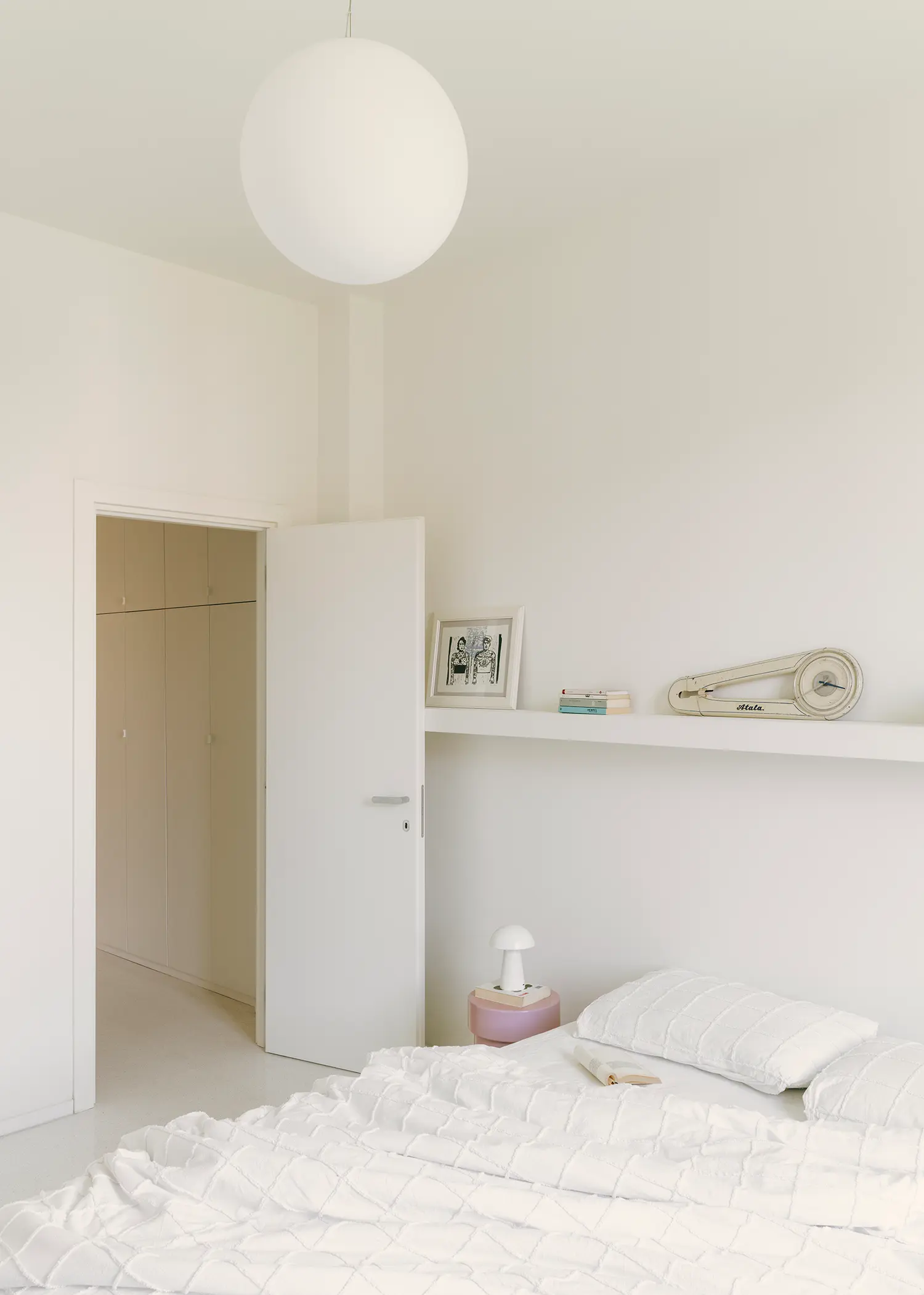 Casa Tahiti by Margine, master bedroom, Glo-Ball pendant lamp, pink Sottsass Chalice bedside table, terrazzo flooring