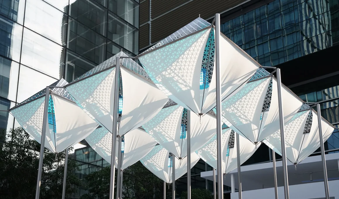 Glacier Project by Dayuan Design, nine suspended white membrane and perforated-metal ice forms on steel poles against Shanghai glass towers