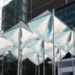 Glacier Project by Dayuan Design, nine suspended white membrane and perforated-metal ice forms on steel poles against Shanghai glass towers