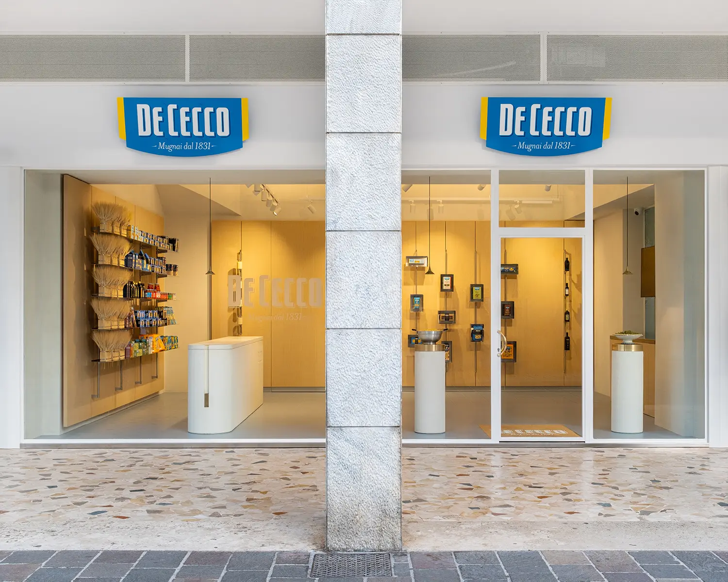 De Cecco Flagship Store by Studio Francesco Faccin, storefront on Corso Umberto I, Pescara, glass windows, De Cecco signage, terrazzo pavement
