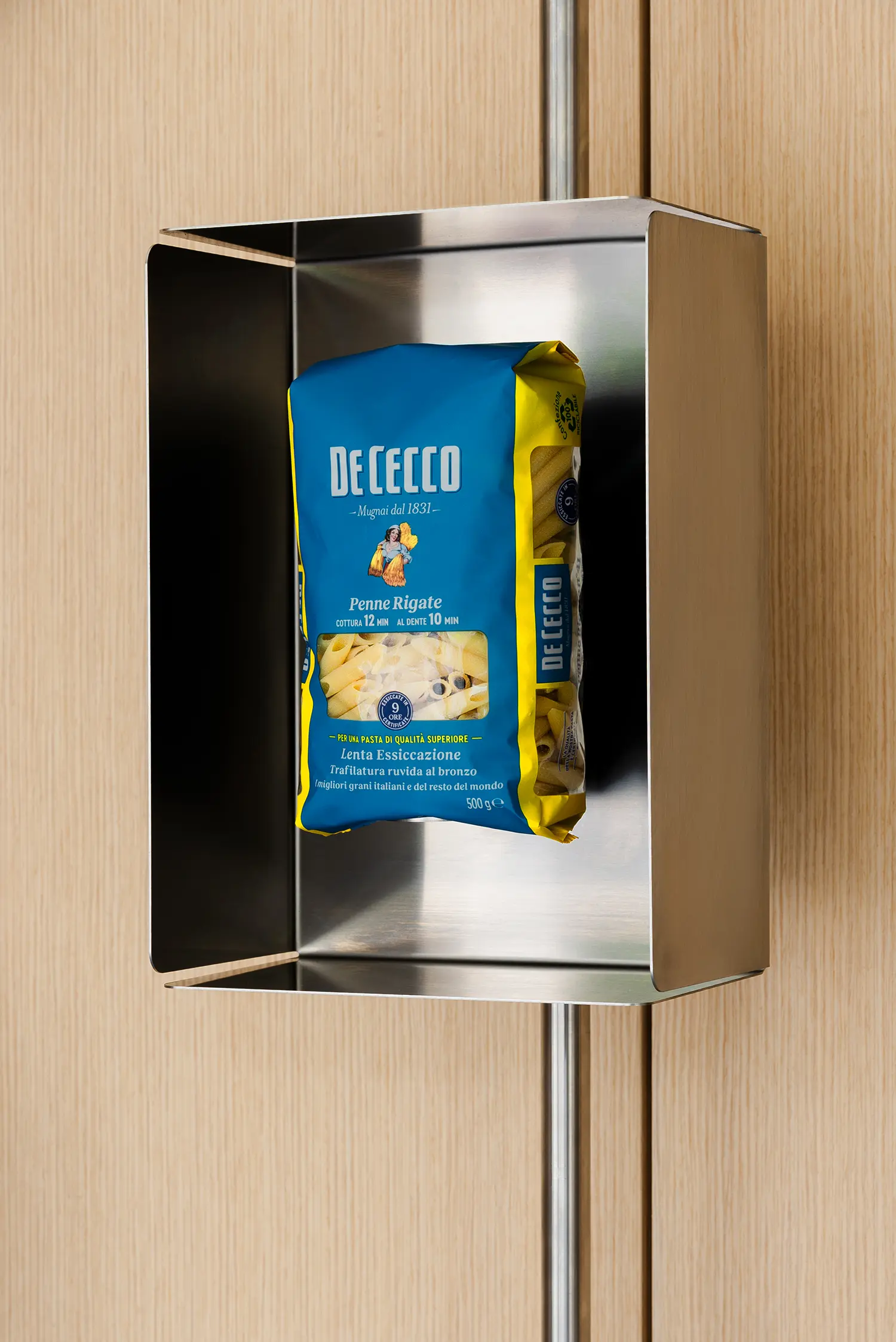 De Cecco Flagship Store by Studio Francesco Faccin, detail of stainless-steel display module holding a single Penne Rigate package
