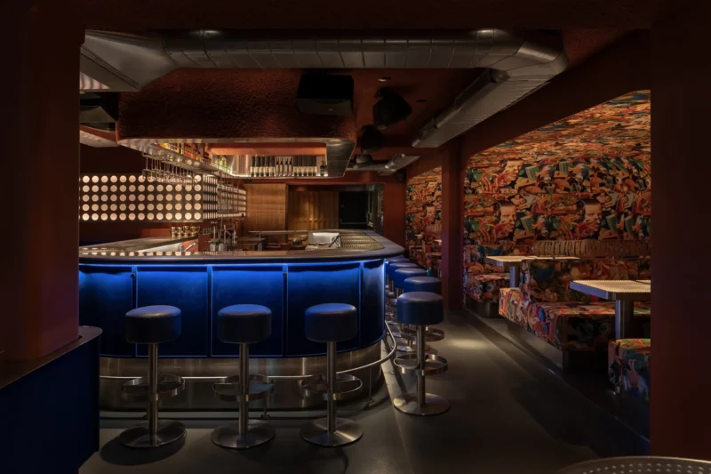 FlipDog basement bar by YOD Group, blue flock counter, WAONE surrealist print upholstery, Shoreditch London