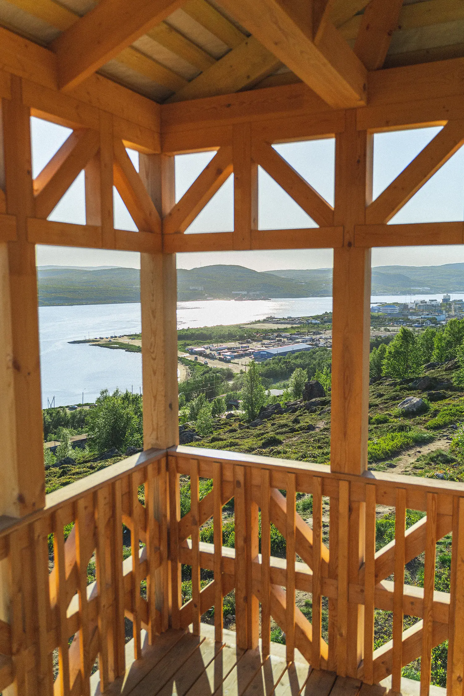 Kola Bay Lighthouse Viewpoint, upper observation deck framing Kola Bay, the town, and surrounding hills