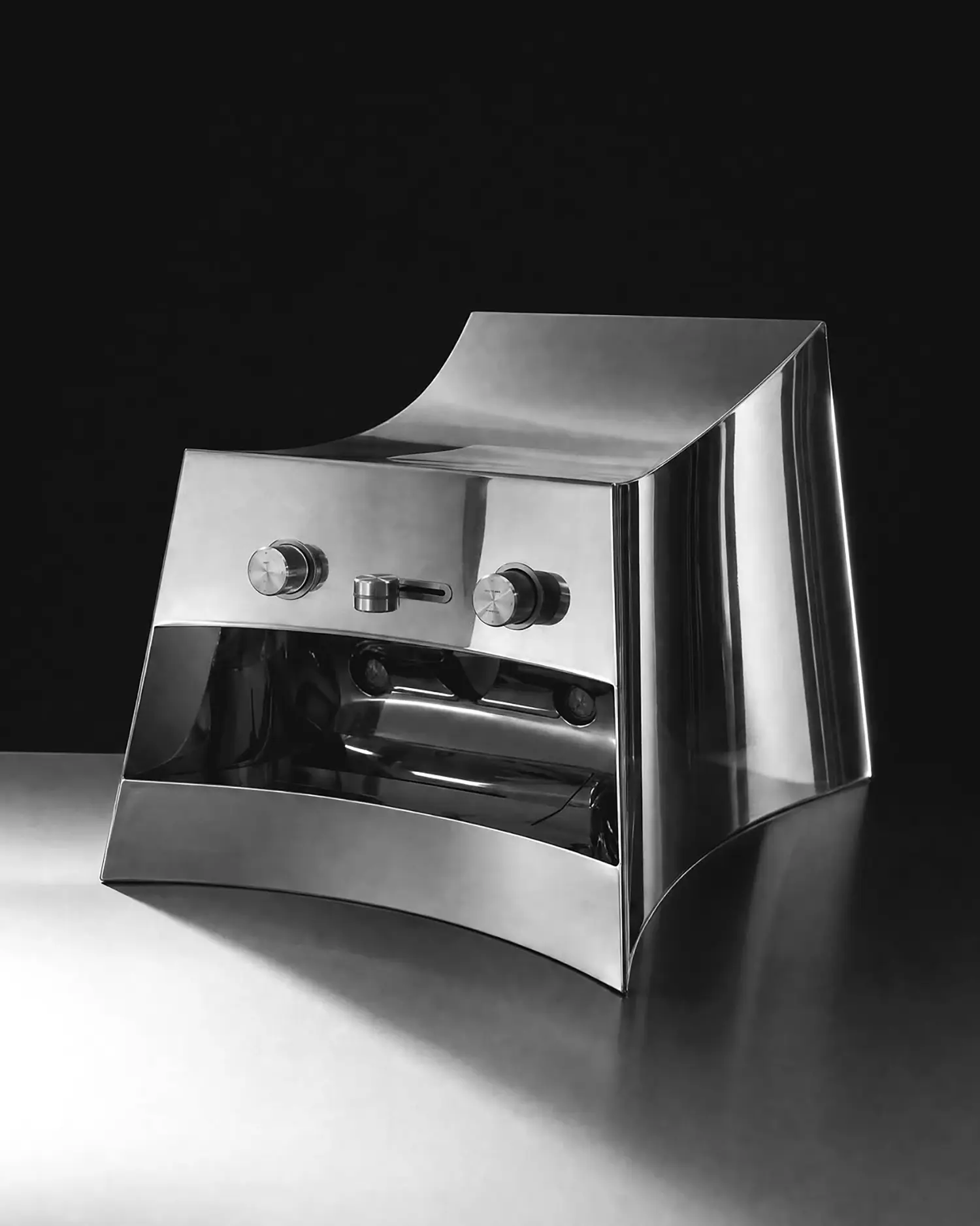 La Marzocco Linea Mini by CALIPER, side three-quarter view, curved steel body reflecting studio lighting, control panel and gauges visible