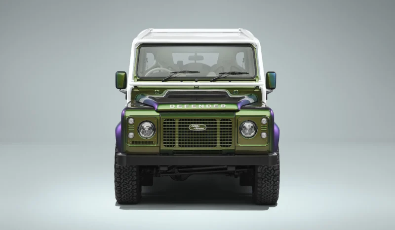Land Rover Classic Defender V8 90 Soft Top, Spectral Green paint, front view, white roll cage and roof bars