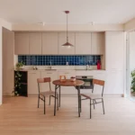 Casa Río by medioestudio, Madrid, open kitchen with terracotta ceramic lattice wall divider