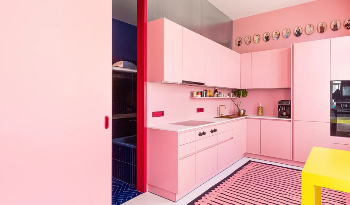 Chromatic Chambers, ASAP-ZT Pitro Sammer: pink kitchen with red marble accents, Vienna. Photo: tschinkersten