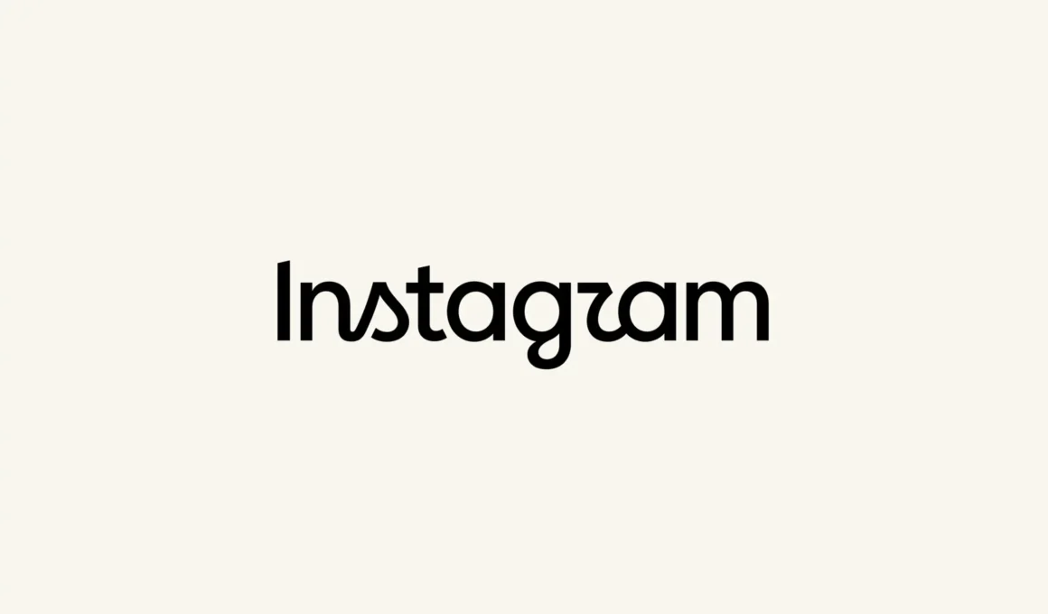 Instagram's redesigned wordmark in black lettering on a cream background, the new script-and-print hybrid construction