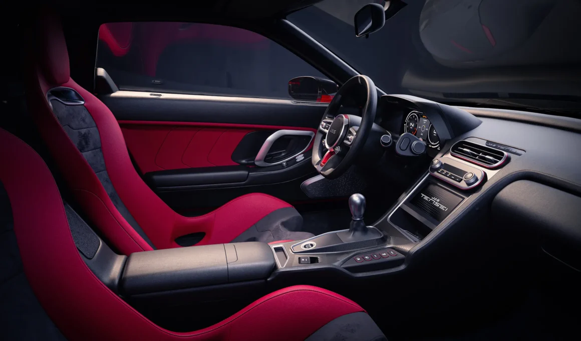 JAS Tensei interior by JAS Motorsport, red leather bucket seats, black dashboard, and center console with JAS Tensei plaque