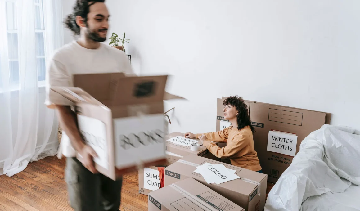 Moving boxes labeled by destination room — office, summer clothes, winter clothes — instead of by contents