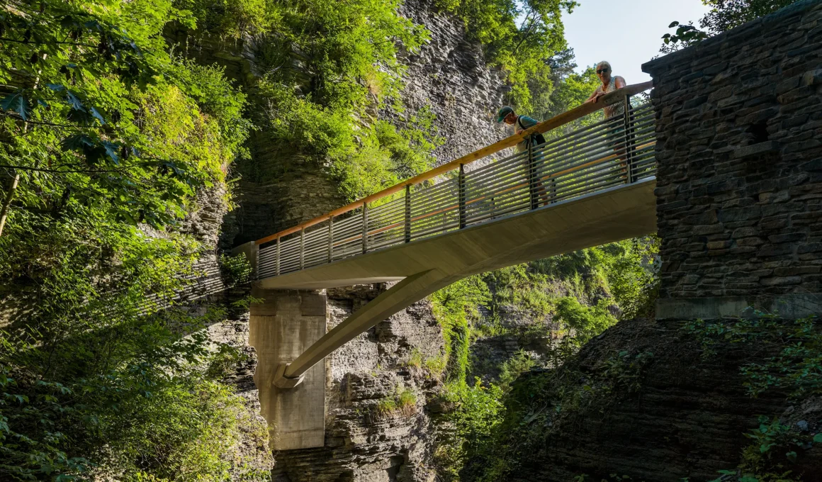 Sentry Bridge by Snøhetta and sbp, cantilevered stainless steel span with wood-capped rail over Watkins Glen gorge
