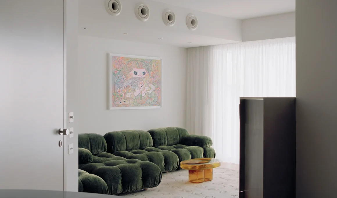 Apartment No. 201 by Anastasiou Misseri, living room with green velvet modular sofa and amber glass coffee table in Nicosia