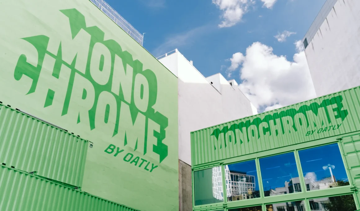 Monochrome by Oatly pop-up by Cee Cee Creative, green shipping containers with painted lettering in Berlin. Photo: Aditya Christian, Mohit Amlani