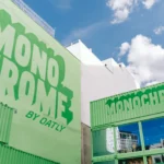 Monochrome by Oatly pop-up by Cee Cee Creative, green shipping containers with painted lettering in Berlin. Photo: Aditya Christian, Mohit Amlani