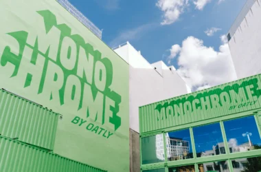Monochrome by Oatly pop-up by Cee Cee Creative, green shipping containers with painted lettering in Berlin. Photo: Aditya Christian, Mohit Amlani