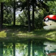 Poké Ball-Themed Hotel by NOT A HOTEL ARCHITECTS, red and white acrylic sphere with curved window beside a forest lake in Tomakomai, Hokkaido