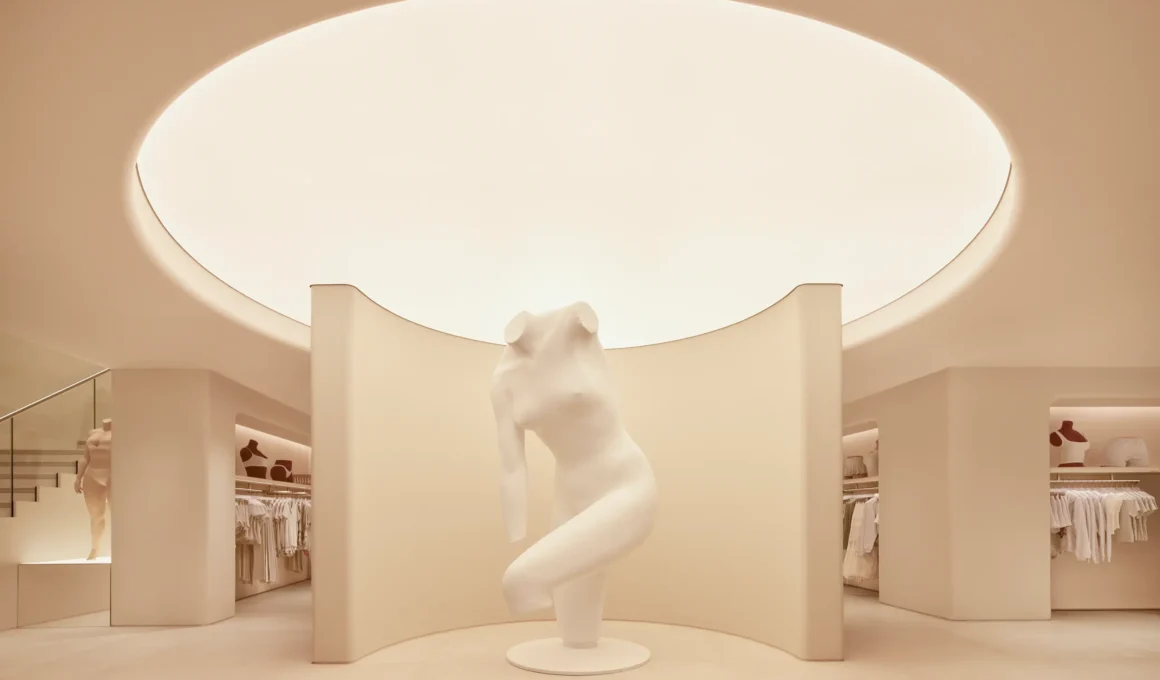 SKIMS London flagship by Rafael de Cárdenas, Vanessa Beecroft nude sculpture beneath a circular skylight