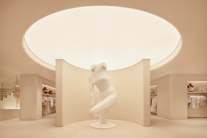 SKIMS London flagship by Rafael de Cárdenas, Vanessa Beecroft nude sculpture beneath a circular skylight