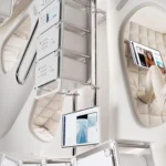Thunderbird Space Station by OMI for Max Space, crew member in padded textile sleeping cocoon with screen, beside modular racks
